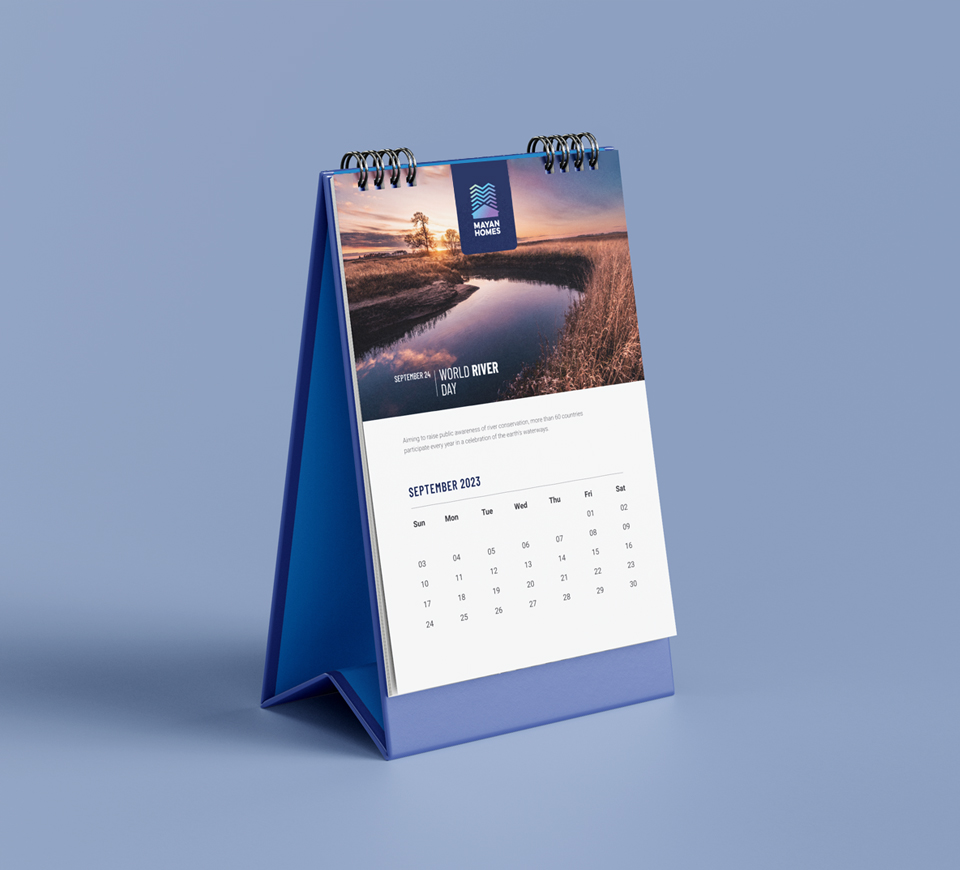 Mayan Homes 2023 Table Calendar with tagline Building Future Lifestyle featuring gated community entrance visual